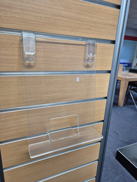 Single clear sloping display stand mounted on wooden slatwall with SBC Plankwall slatwall clips