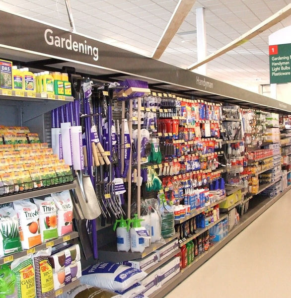 25mm aluminium display slatwall panel in the Gardening section in a store with various products on shelves.