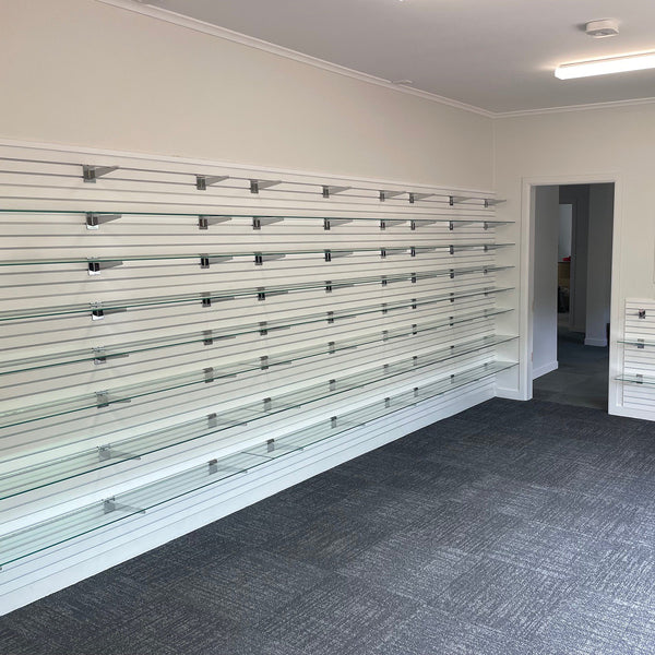 50mm pitch aluminium slatwall interior with metal shelf brackets and glass shelves
