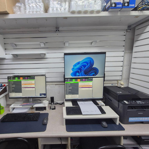 50mm slatwall workstation set-up with two computer monitors on a desk with a printer in a store setting