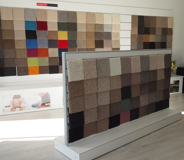 60mm slatwall gondola display of carpet samples in various colors and textures.