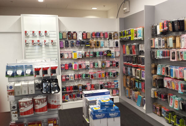 Store interior with shelves displaying various products on 75mm pitch slatwall