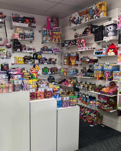 Toy store  features products on 9mm shelves and display plinth cubes stocked with various toys and products.