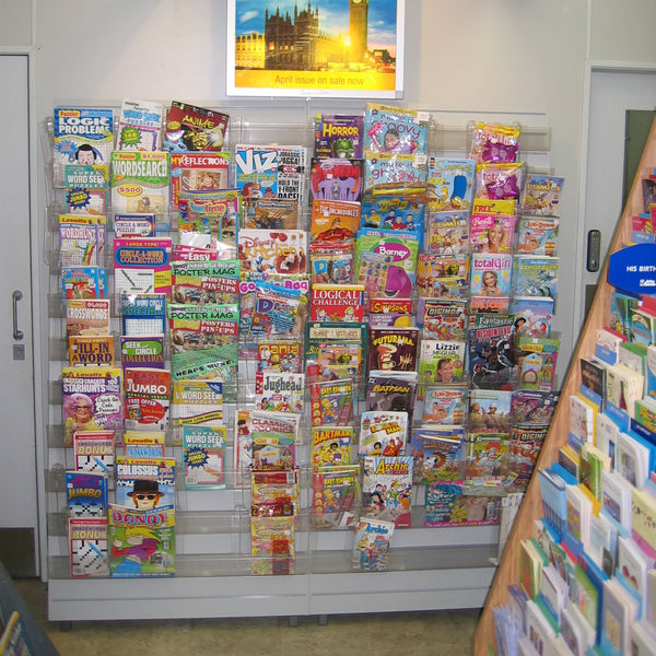 Photo of Calext adjustable print display unit used as a magazine rack in a retail store.