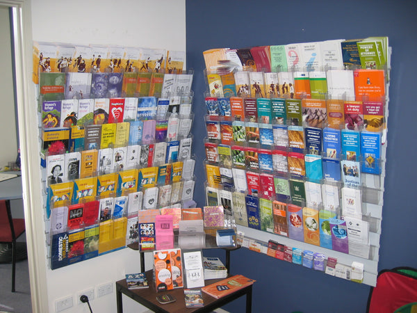 Display of brochures and leaflets on a Calext modular wall-mounted pamphlet rack in a medical waiting room