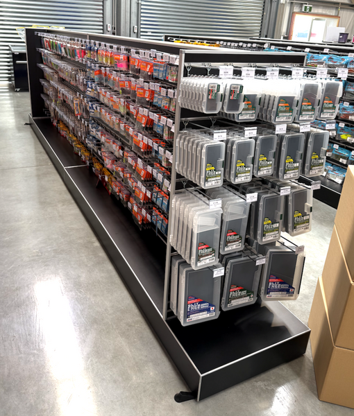 2x Plankwall Retail display double plinth gonola in black merchandised with stock in a retail store.