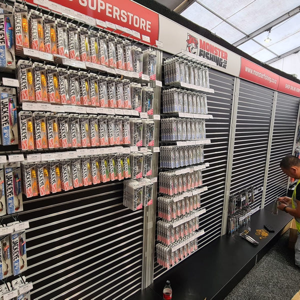 Plankwall Free Standing black slatwall free standing display walls. Code FS2212PW using G18PB. With plinth, 50mm aluminium pitch stocked with fishing gear at Monster Fishing showroom