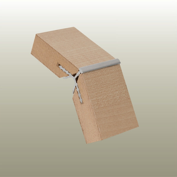 close up shot of a sample of a MC135 aluminium 135 degree corner join in light wood MDF on a gold background