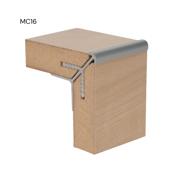 Photo of a MC16 round head aluminium external corner join in 16 mm MDF panels in close up on a white background