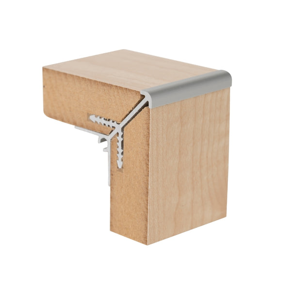 A close-up of a MC18X external corner join joining  MDF panels shown on a white background.