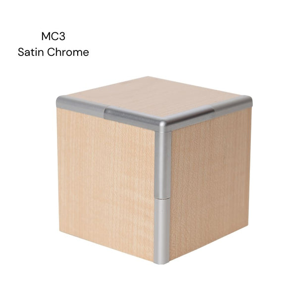 A MC3 3 way corner join sample shown in satin chrome aluminium joining light wood MDF panels on a white background labelled MC3 Satin Chrome.