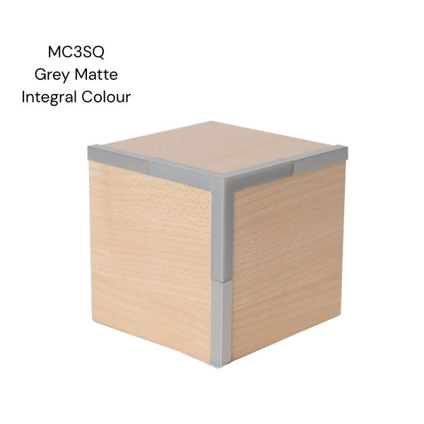 A MC3SQ square head 3 way corner join sample shown in integral colour aluminium joining light wood MDF panels on a white background labelled MC3SQ grey matte integral colour.