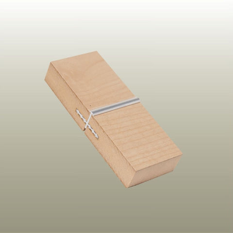 A sample of an aluminium Stickman MCBUT butt join profile in two light wood MDF panels on a gold background 