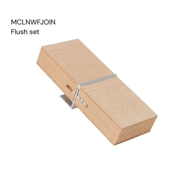 a close up of a Stickman Linear MCLNWFJOIN sample - a aluminium butt join profile in flush set with wall fix in MDF panels on a white background labelled with the product name