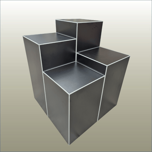Set of 4 cube retail display stands in black shown grouped together clear cut on a gold background