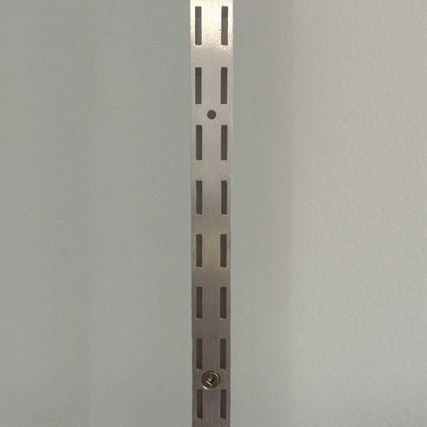 shown here is Plankwall's double slotted wall channel in aluminium mill finish supports metal shelving for retail displays