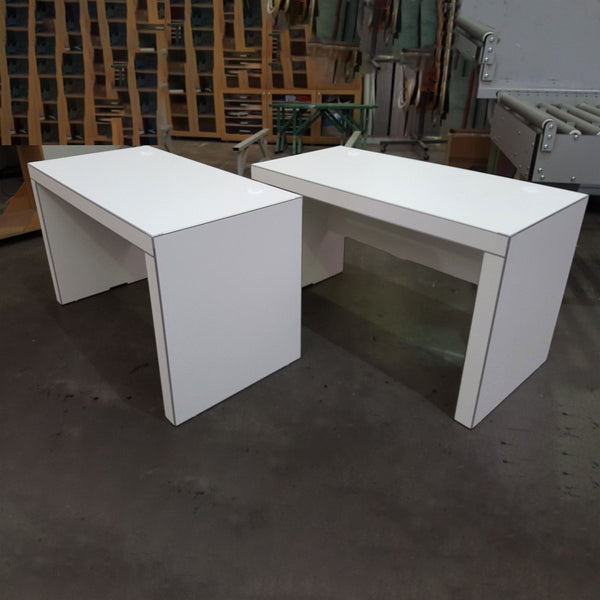 Two white Kingston Office Desks in Plankwall warehouse, modern NZ-made workspace desks with aluminium Stickman edging