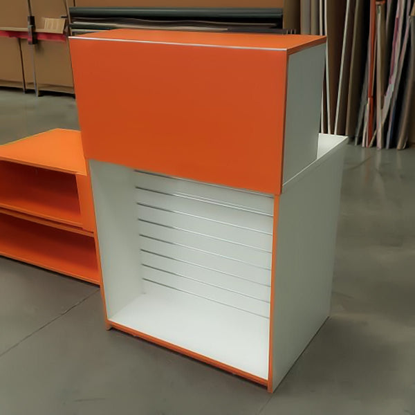 orange and white custom retail cabinet with slatwall feature