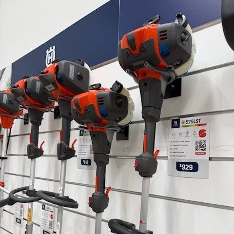 a close-up of products supported by power tool display brackets on slat wall