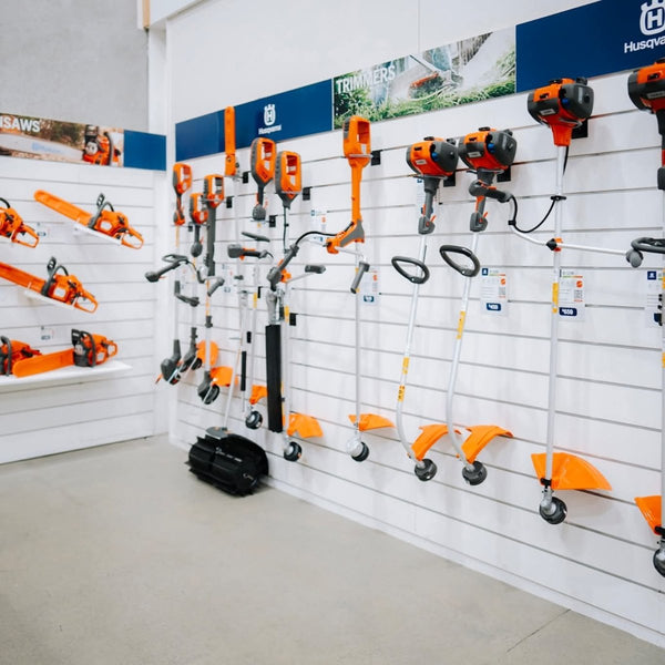 Power tool display brackets support products on retail display wall 