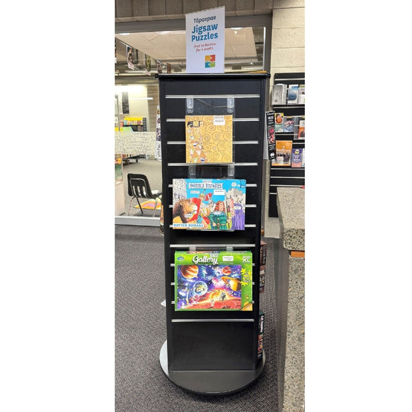 Plankwall 3 sided triangular free standing display in black in library