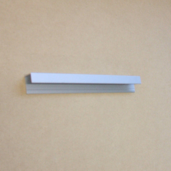 Close up shot of Plankwall All Ali 25mm pitch aluminium slatwall top cap 