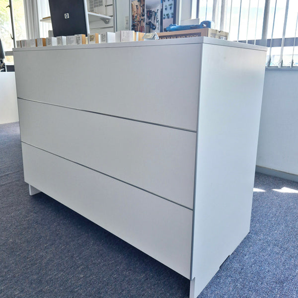 Front view of Plankwall Cashier Desk/ counter top in office. White with aluminium edging.