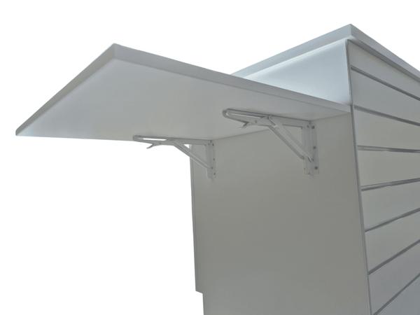 Close up of a fold down shelf attached to the front of a Plankwall Retail Counter in white with slatwall hanging display space on a white background