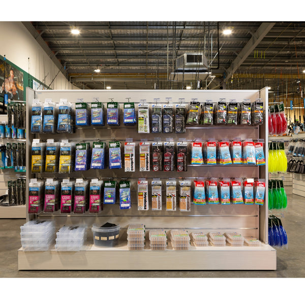 Plankwall Retail Display Free-Standing Gondola in blonde wood finish with Display of fishing tackles and accessories in a store setting