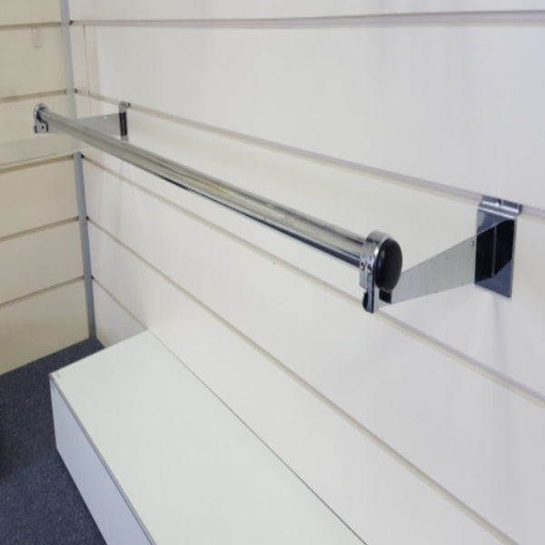 Plankwall Garment Rail attached with metal brackets to white slatwall