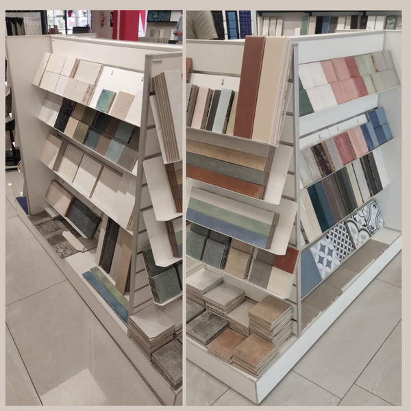 Plankwall Double Plinth G60 Gondola in white shown stocked with sloping shelves and tiles