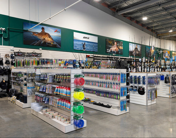 Plankwall retail fit out of Hunting & Fishing store using Plankwall Slatwall wall panels and Plankwall slatwall gondolas for floor stock merchandised with fishing equiptment. 