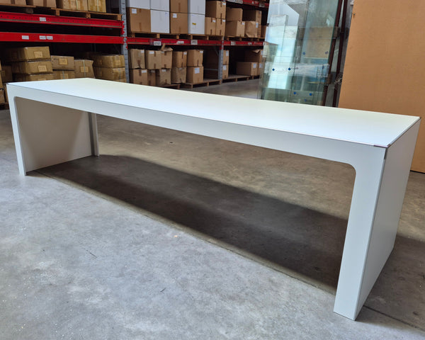 Large Plankwall Retail display table in white in a factory setting