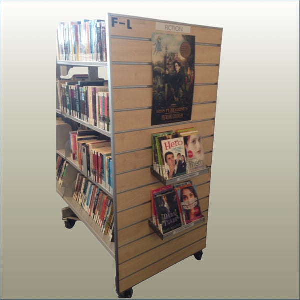Library bookshelves witha PLankwall bay end displaying featured books and magazines on a gold background