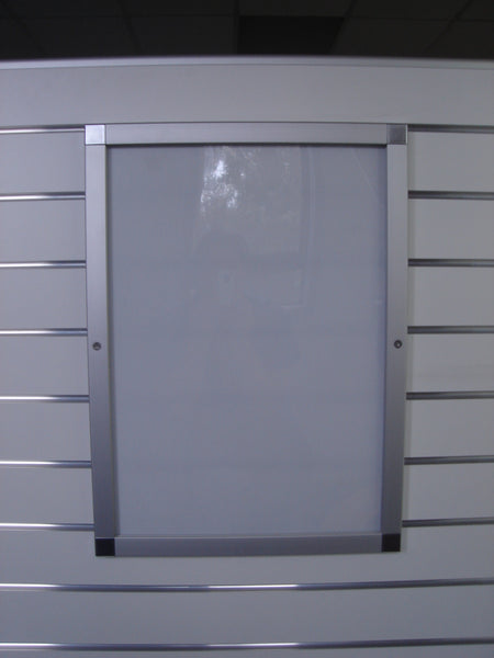 Photo of a Plankwall lockable snap frame for signs and posters mounted in a slatwall panel