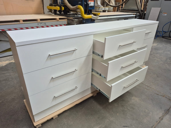 Plankwall white drawer cabinet unit center drawers open in a factory setting