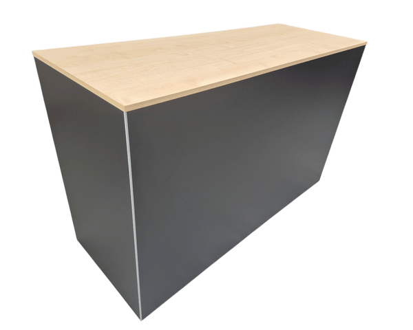 Plankwall retail counter in black with a maple wood finish top on a white background
