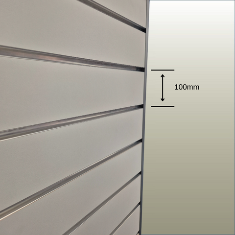 Close-up of a slatwall panel showing the grooves and the 100mm pitch dimension.