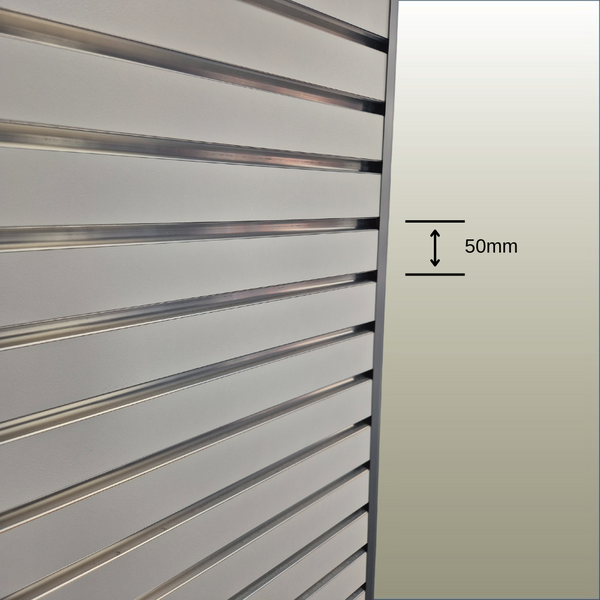 Close up of Plankwall 50mm pitch slatwall panel showing width measurement between grooves on a gold background