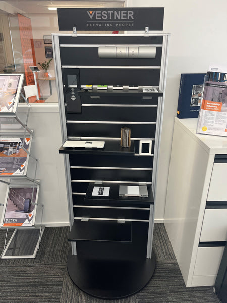 Photo of a showroom using Plankwall's two sided display stand in black featuring information 