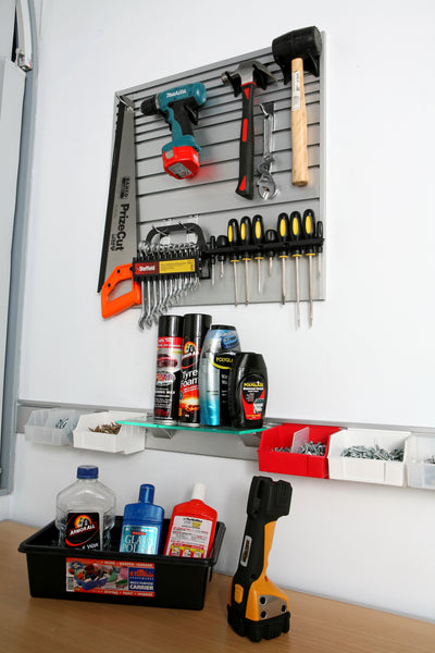Plankwall Utility Plank storage system for tight and small spaces used in a workshop as a tool organizer with various tools and supplies.