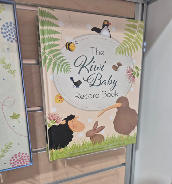 photo of a book displayed on an acrylic display shelf wall mounted on a saltwall panel