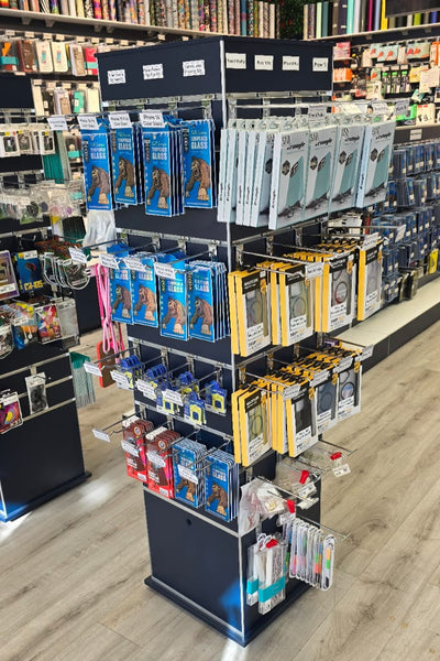 Plankwall box tower display stand in black slatwall  -TOWX164ECON - in a retail store setting displaying phone accessories