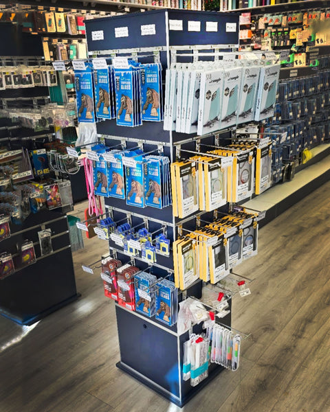 Plankwall box tower display stand in black slatwall  -TOWX164ECON - in a retail store setting displaying phone 