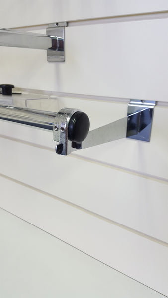 CLose up of a Plankwall customisable Garment rail showing end caps and tube joiners detail, attached to a metal bracket on slatwall