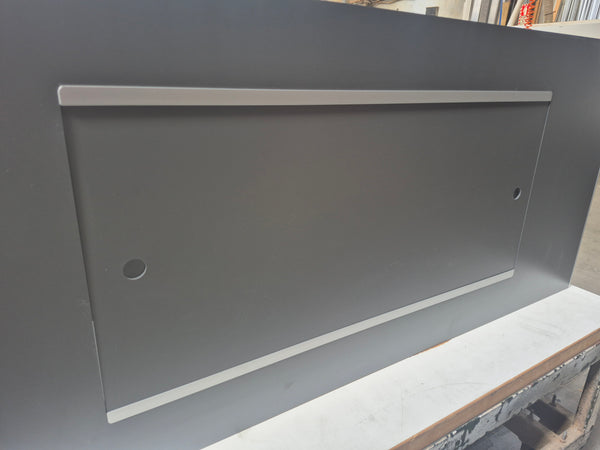 A photo of a sliding cupboard showing a detail of the door track with doors closed.