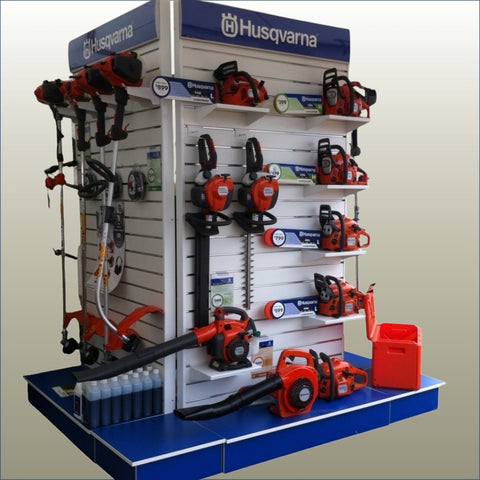 Plankwall premium free standing wall display panels displaying Husqvarna power tools on a gold background.