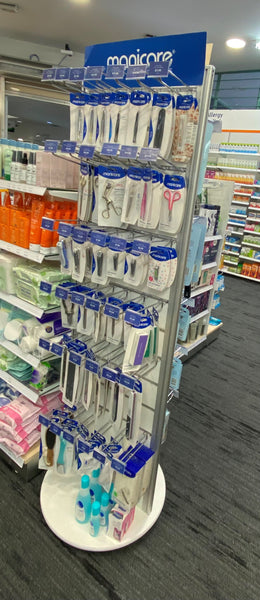 Plankwall rotating Slatwall Retail display slatwall stand displaying Manicare products in pharmacy