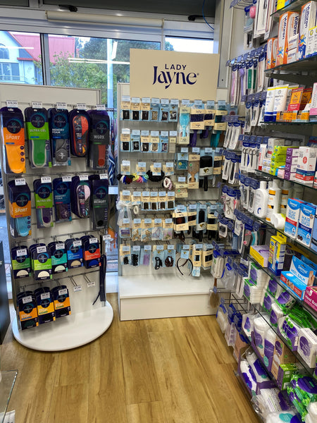 3 Plankwall retail display slatwall stands in a pharmacy