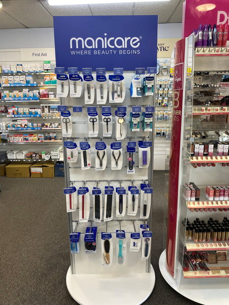 Plankwall rotating Slatwall Retail display stand displaying Manicare products in retail